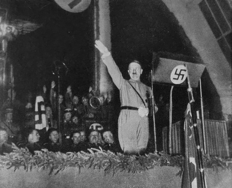 Hitler gives a speech to the old fighters about the National Socialist revolution in Munich's exhibition hall